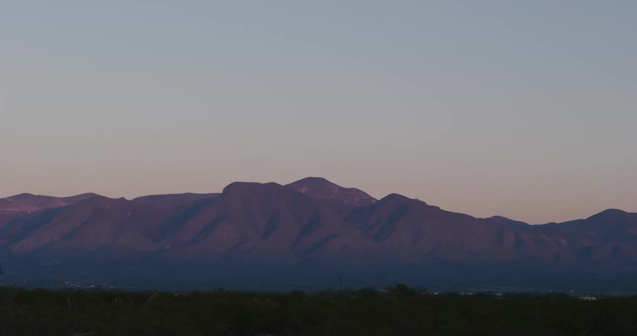 Buildings in a rural area near a mountain range