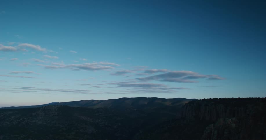 Clear blue skies over a mountainous landscape