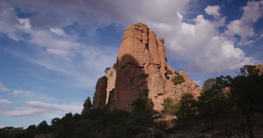 Landscape of canyons like geological erosions and a blue sky with clouds