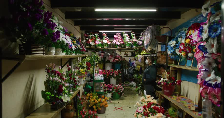 Flower bouquets on the shelves of a small shop
