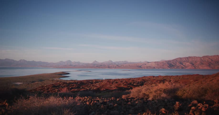 The coast of a beach is surrounded by a body of water