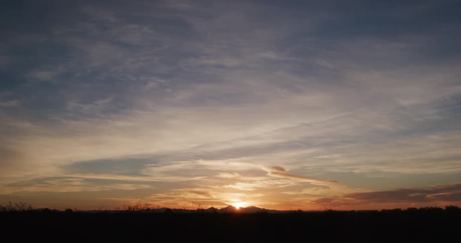Silhouette of mountains on the horizon and the sun rising