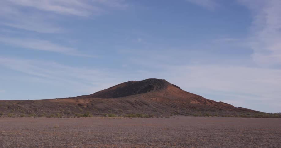 A mountain is in the desert