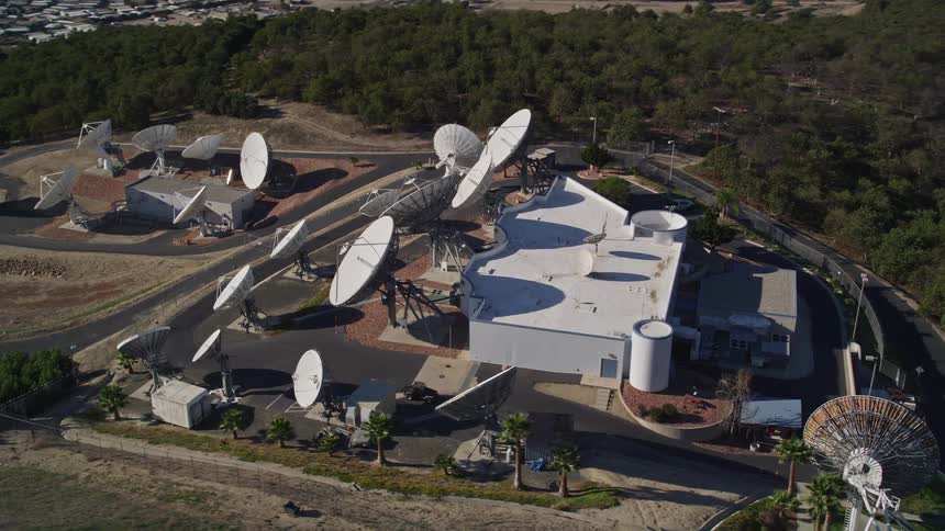 An array of satellites is on the hill above the town