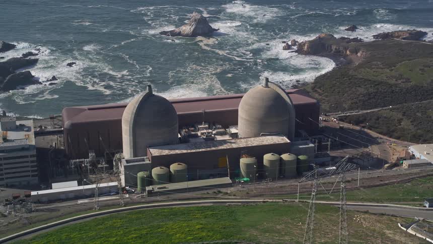 A nuclear power plant sits on a coast