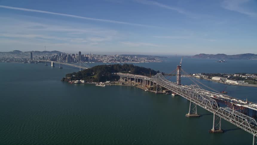 Large city bridges transverse an island near the downtown area