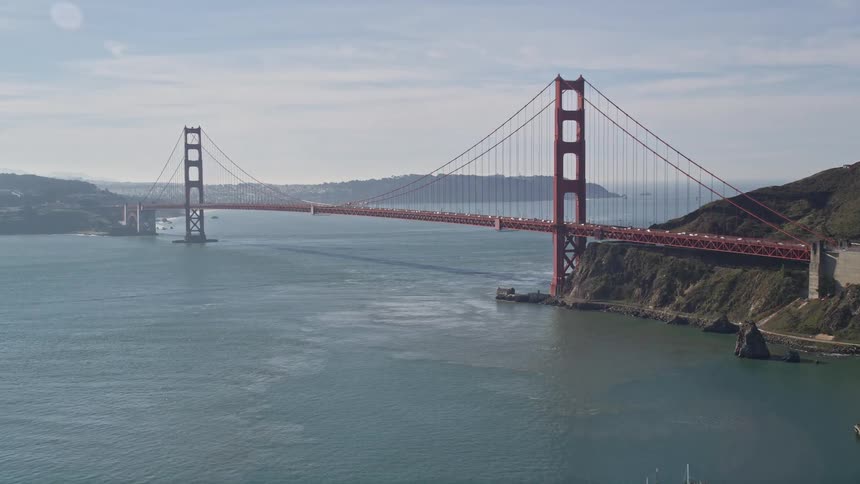 Aerial panorama of the famous golden gate bridge over the sea connecting peninsulas and a city