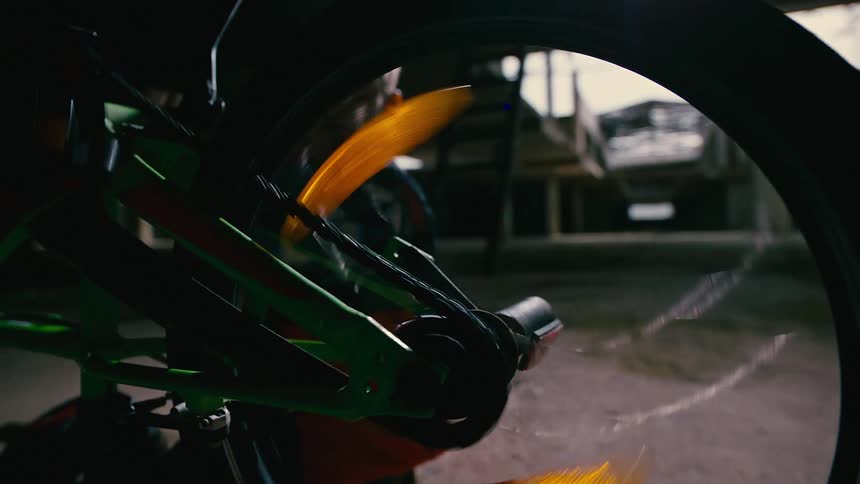 A clip of a boy playing with a bicycle tire
