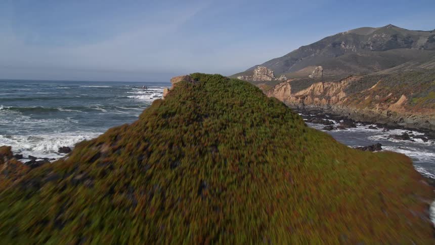 Aerial scenery of a peninsula with sea and rocks and mountains