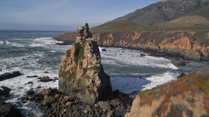 Aerial panorama of a peninsula with rocks and mountains and the sea around it