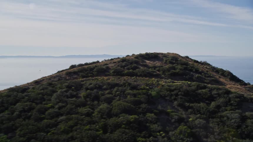Mountains give way to a coastal community