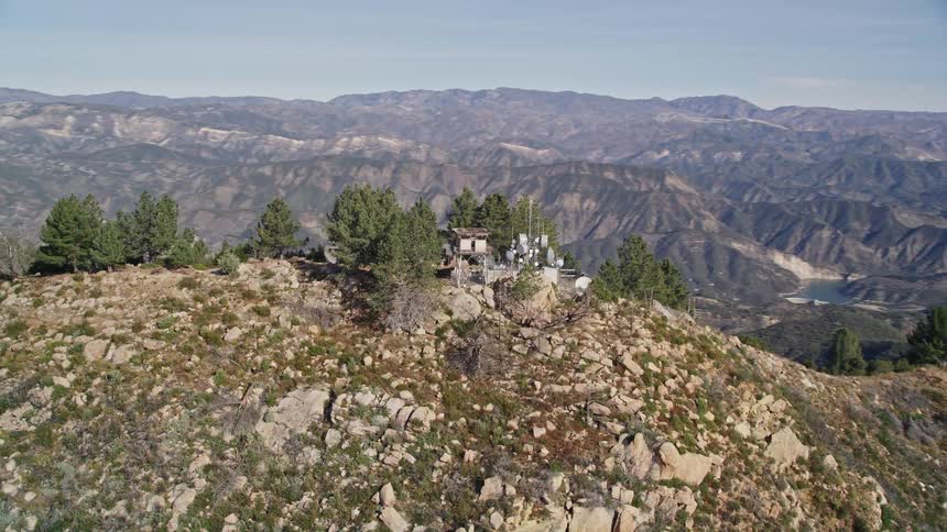Aerial panorama of an antenna station on a mountain peak