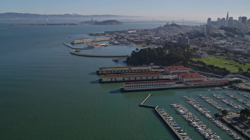 A large port gives way to an enormous coastal city