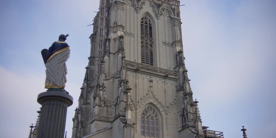 View of the Bern Minster from behind the Mosesbrunnen fountain