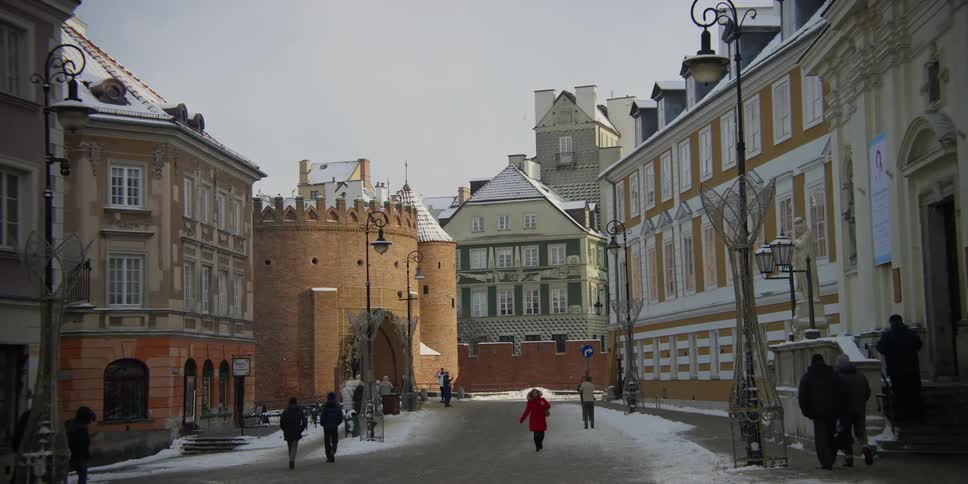 People walking in Old Town near the Warsaw Barbican, Poland