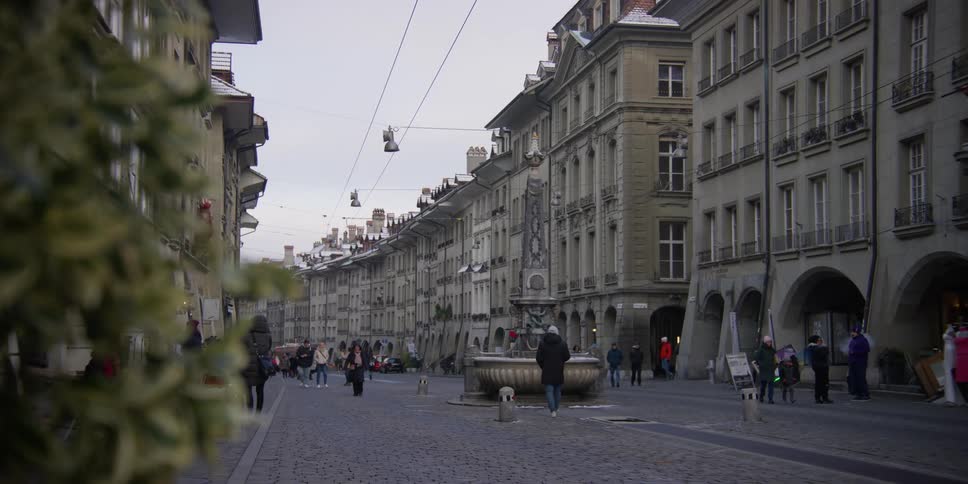 People walking and shopping on the Kramgasse in Bern, Switzerland