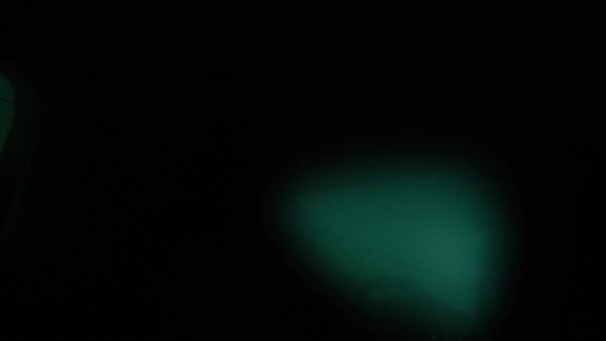 Out of focus footage of green fog or mist