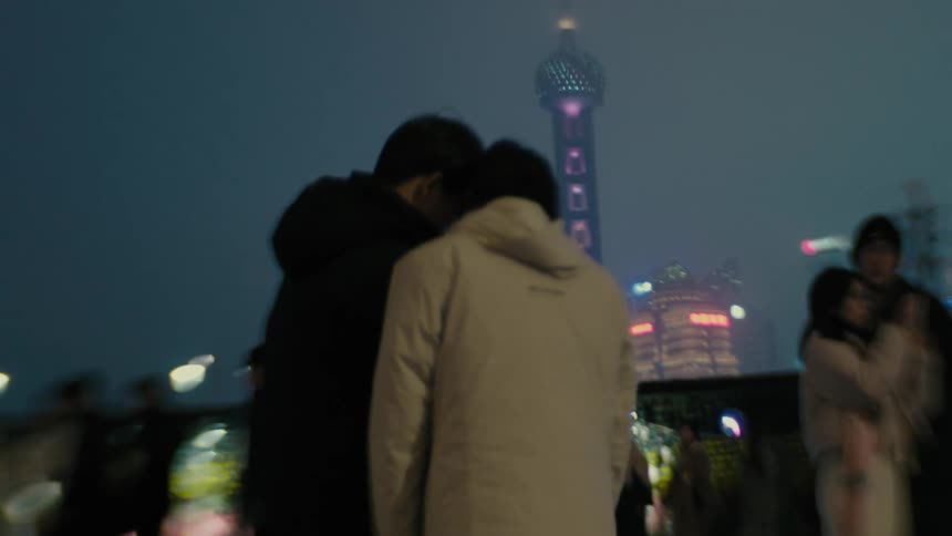 A couple take a selfie near the city