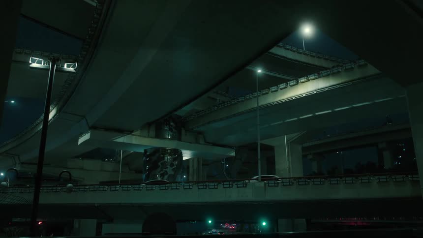 Vehicles on an overpass in the city at night