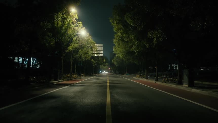 The dark road leads to the city