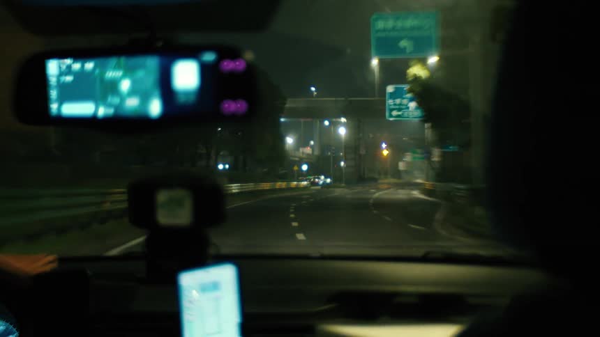 Inside perspective of a car during a night drive