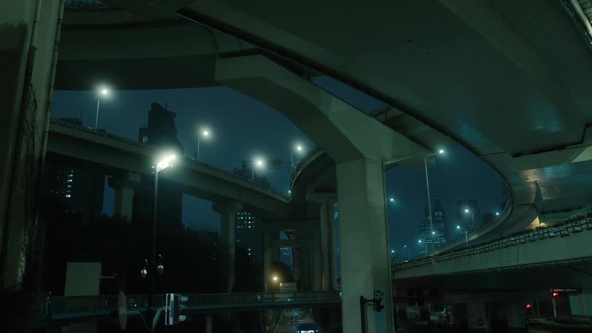 Under yanan elevated road in the center of shanghai china cars drive past