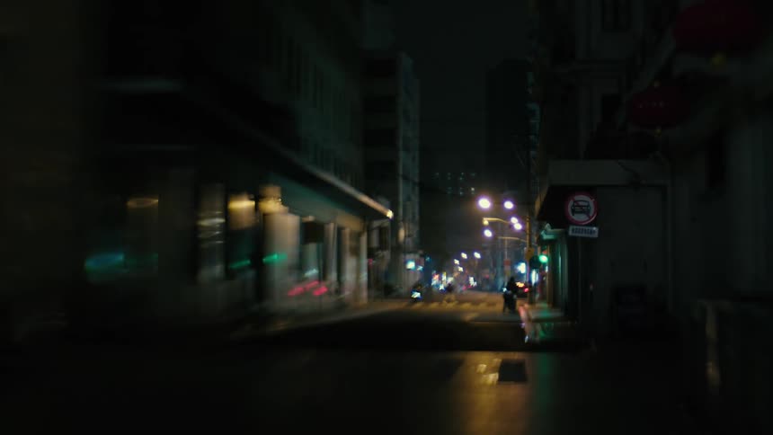 Dark street in a metropolis with buildings at night