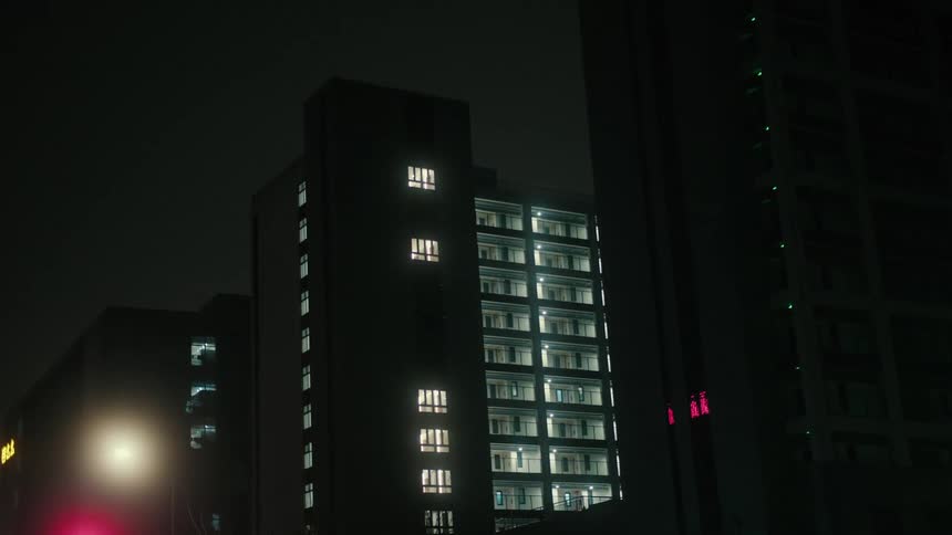 Residential buildings in urban illuminated at night