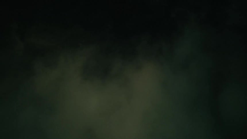 Clouds swirl in the night sky