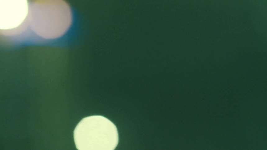 Closeup of lampposts around the city at night