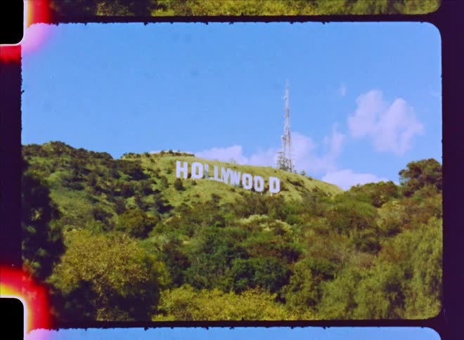 Hollywood sign on a mountain peak in daylight