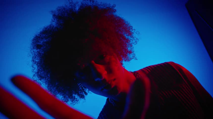A black teenage girl gestures with her hand