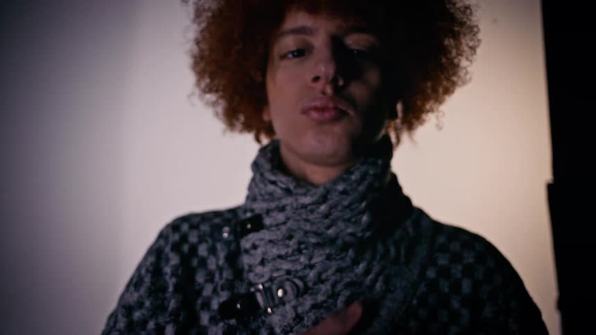 A person is modeling a sweater