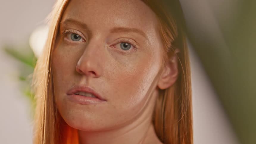 Portrait of a young redhead with blue eyes