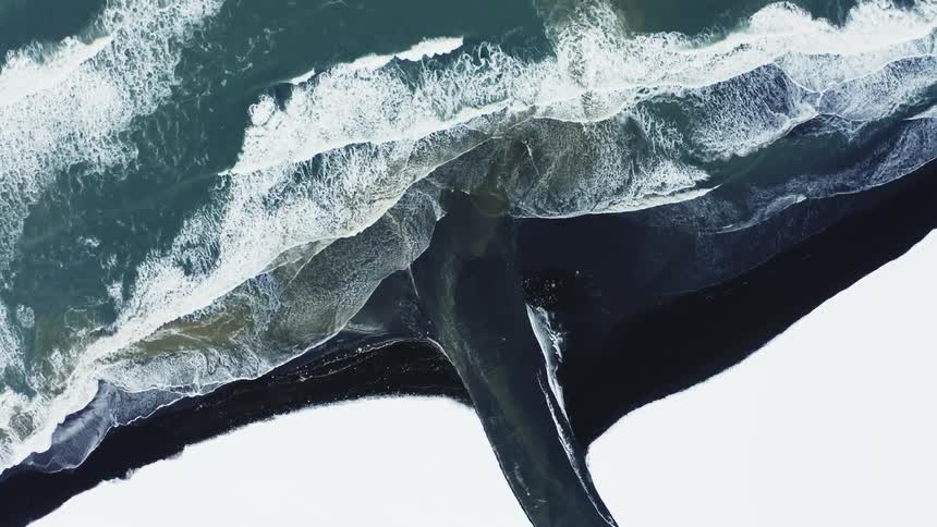 Ocean waves move to a shoreline