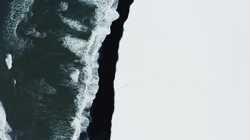 Ocean tides move to a frozen shore