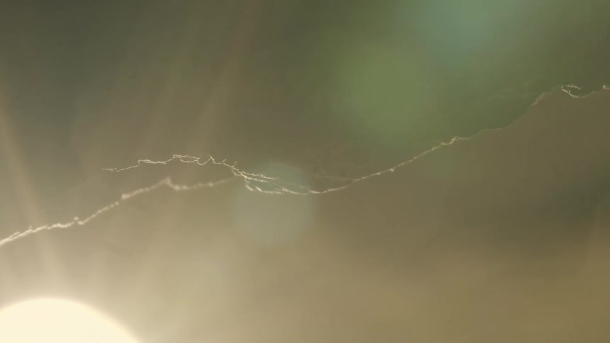 Eroded piece of rock in extreme closeup and sun flare