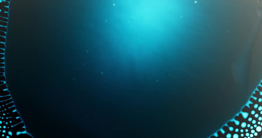 Smooth area with a bright blue center expands through a dark fluid then shrinks leaving blue spots