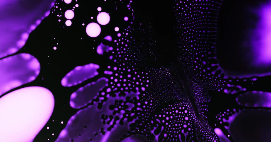 Extreme closeup of a vibrant purple fluid coagulated in an abstract manner