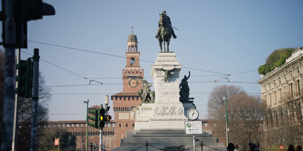 A statue of Vittorio Emanuele II in front of Sforza Castle in Milan, Italy