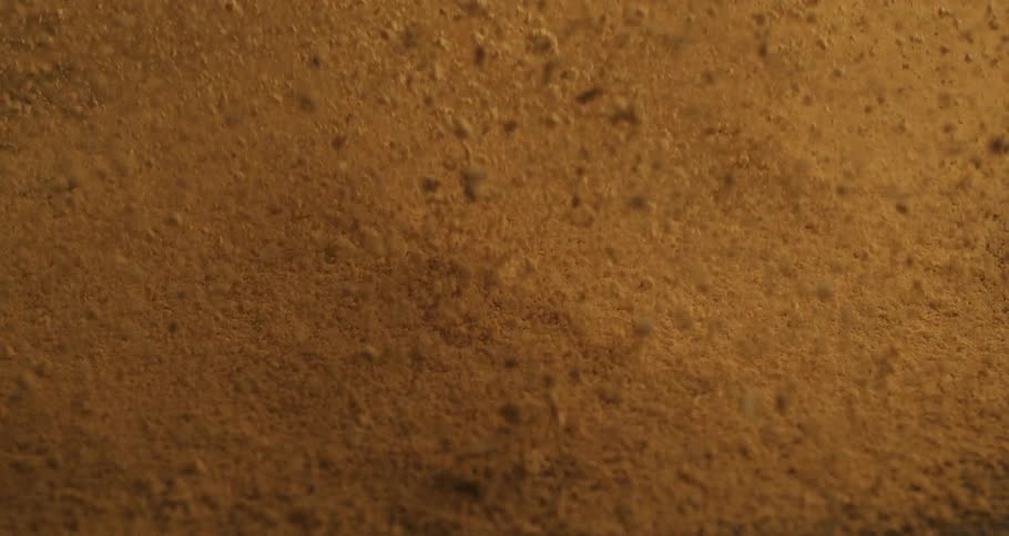 Dirt flies into the air then falls onto the ground after an explosion