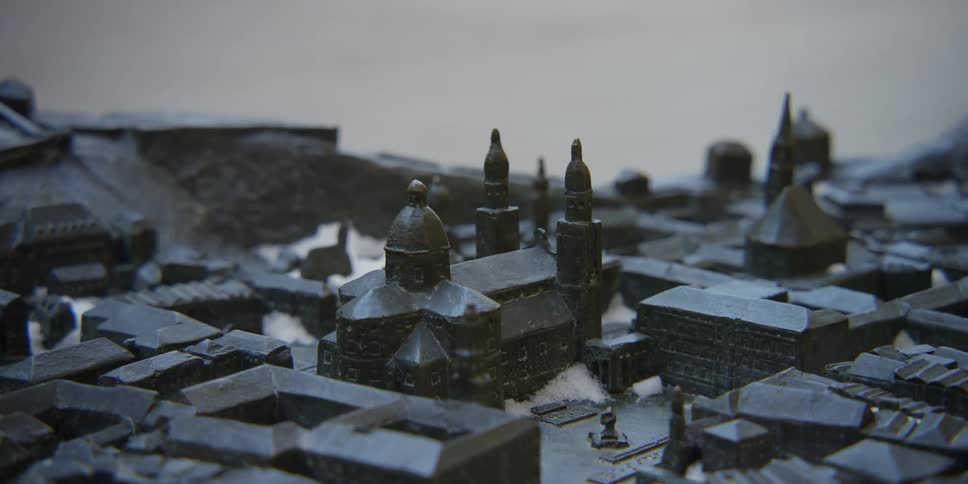 A bicycle rides by a small model of Salzburg, Austria