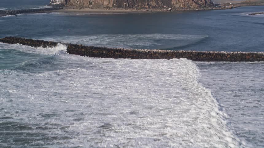 A seawall holds water away from a coastal area