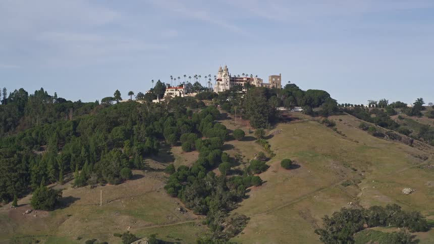 A mansion is on top of the mountain
