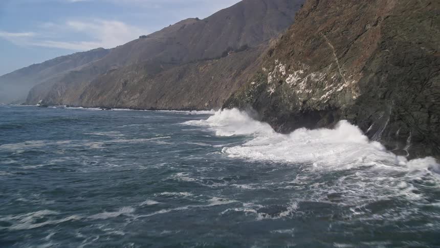 Strong sea waves hitting the rocky shore