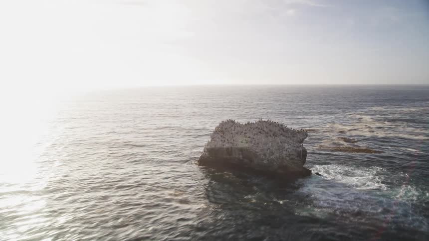 Waves moving against a rocky shoreline