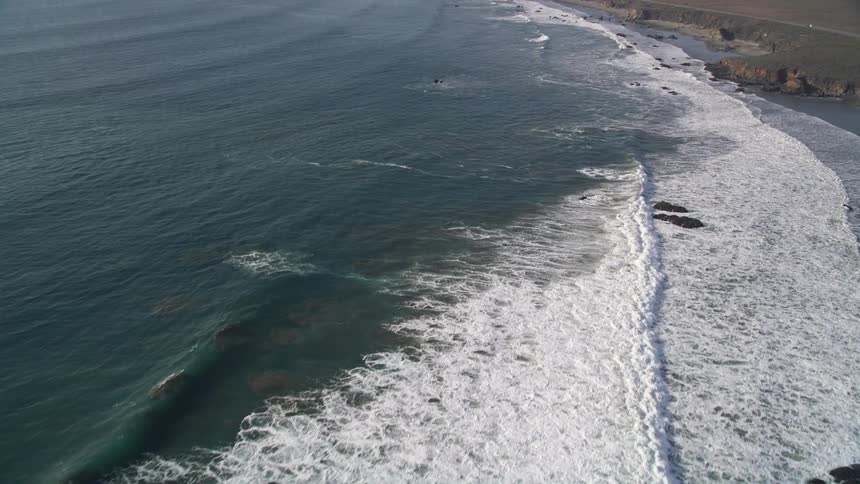 Ocean with waves meeting the rocky shore