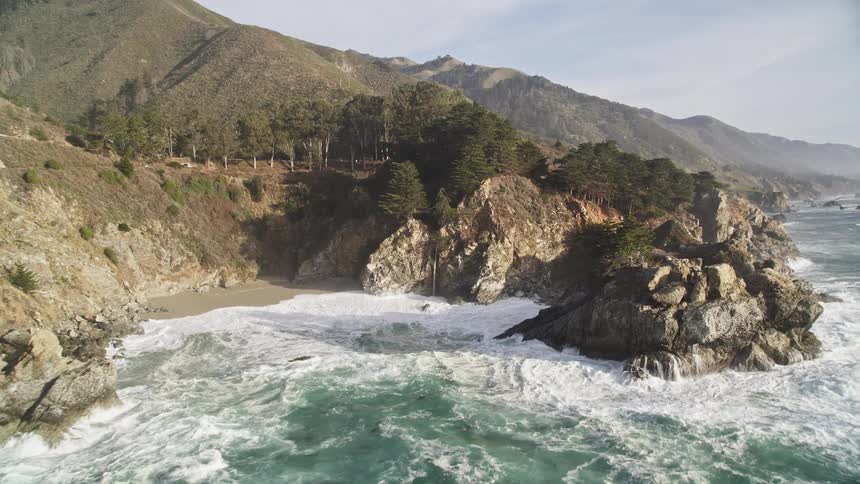Waves crash against the shore