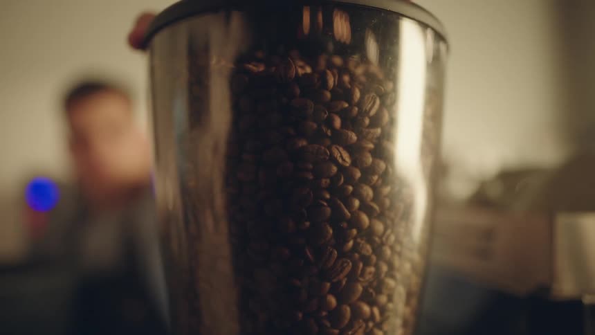 Closeup of a container filled with coffee beans