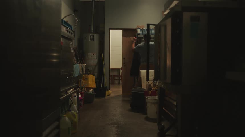 A food worker arrives at a restaurant